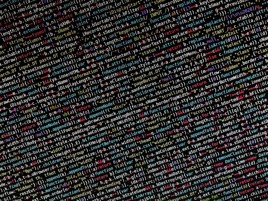 Close-up image of a computer screen filled with colorful lines of code, featuring various programming language elements such as function calls, variables, and syntax highlights. The display showcases